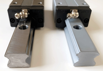 Side-by-side finish comparison of linear guideways with standard versus Thin Dense Chrome (TDC) finishes.